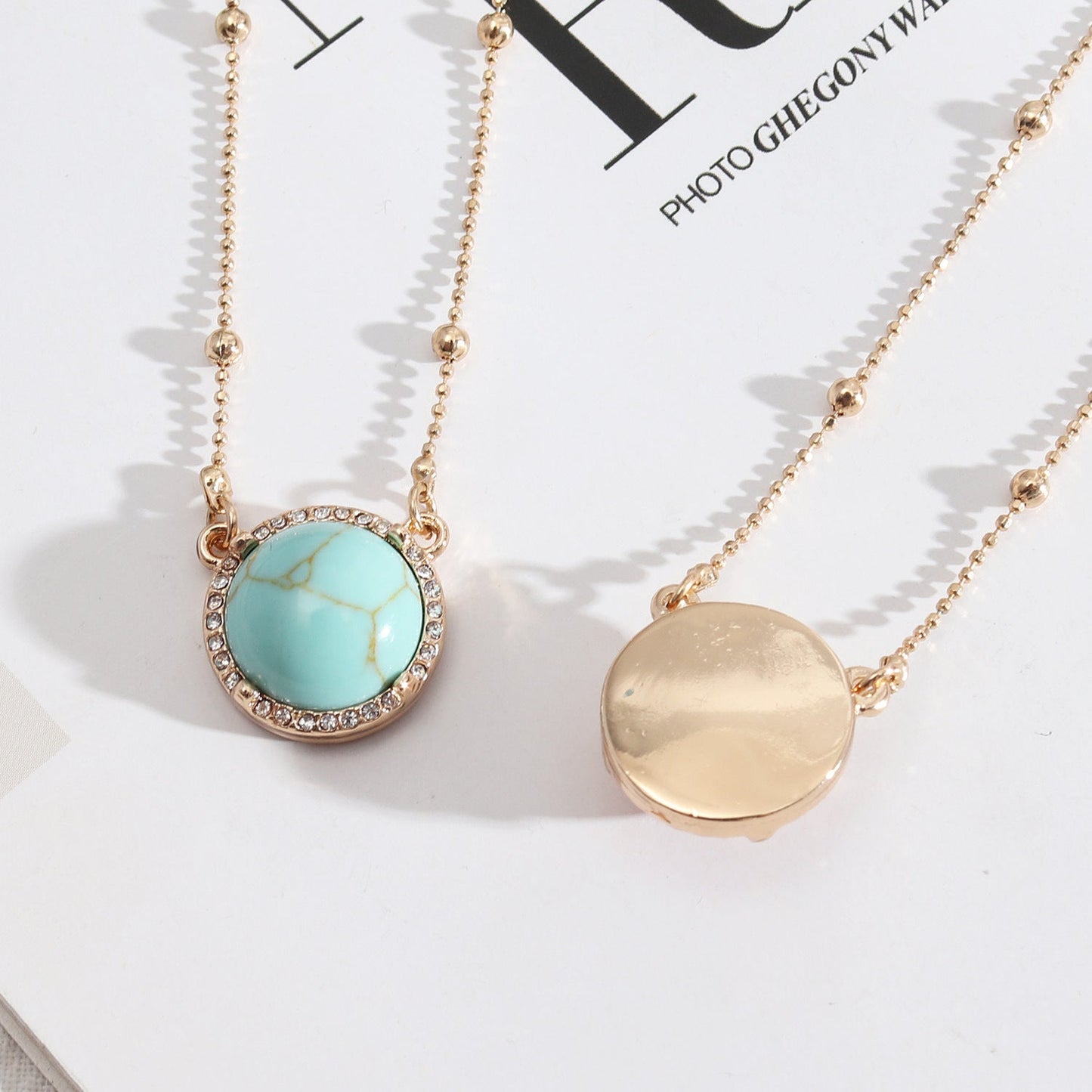 Natural Stone Dome Style Gold Pendant Surrounded by Sparkling Gems.