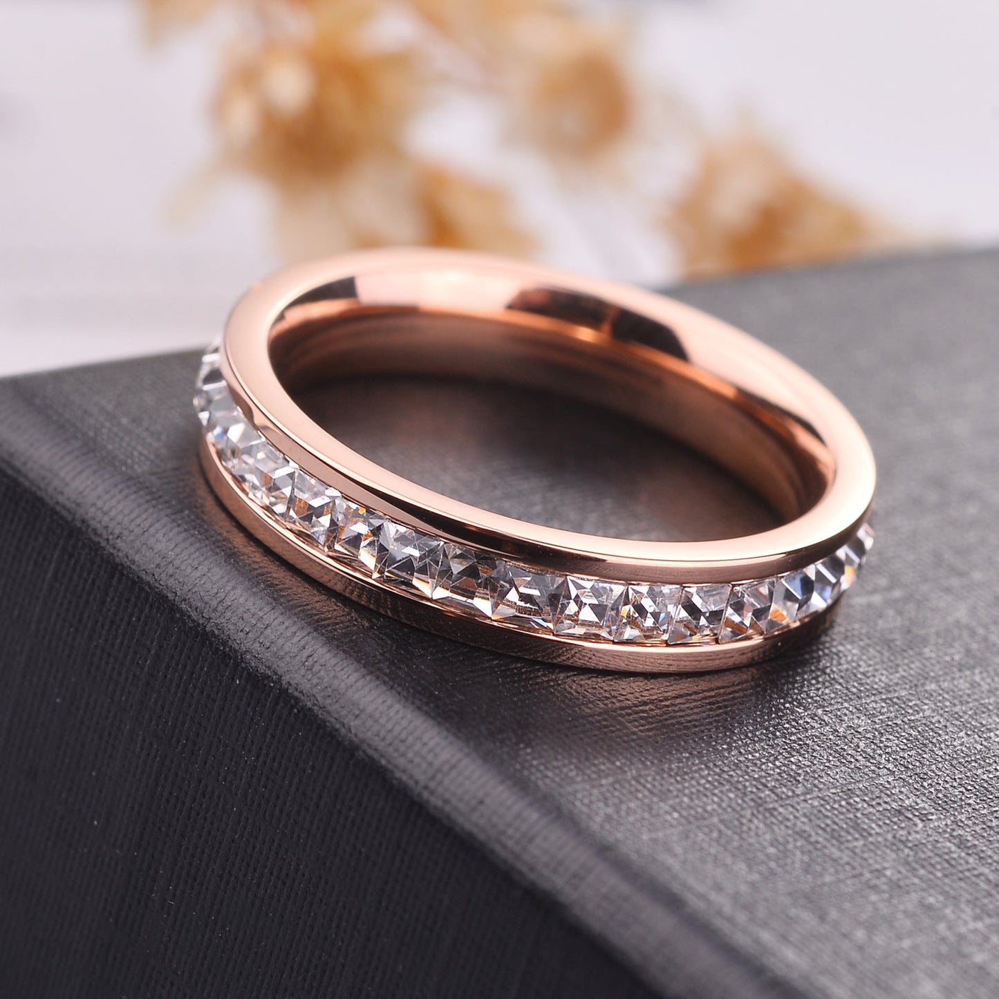 Simple and Elegant Titanium Steel Gold-plated 18K Rose Gold Ring with Sparkling CZ Inlay.