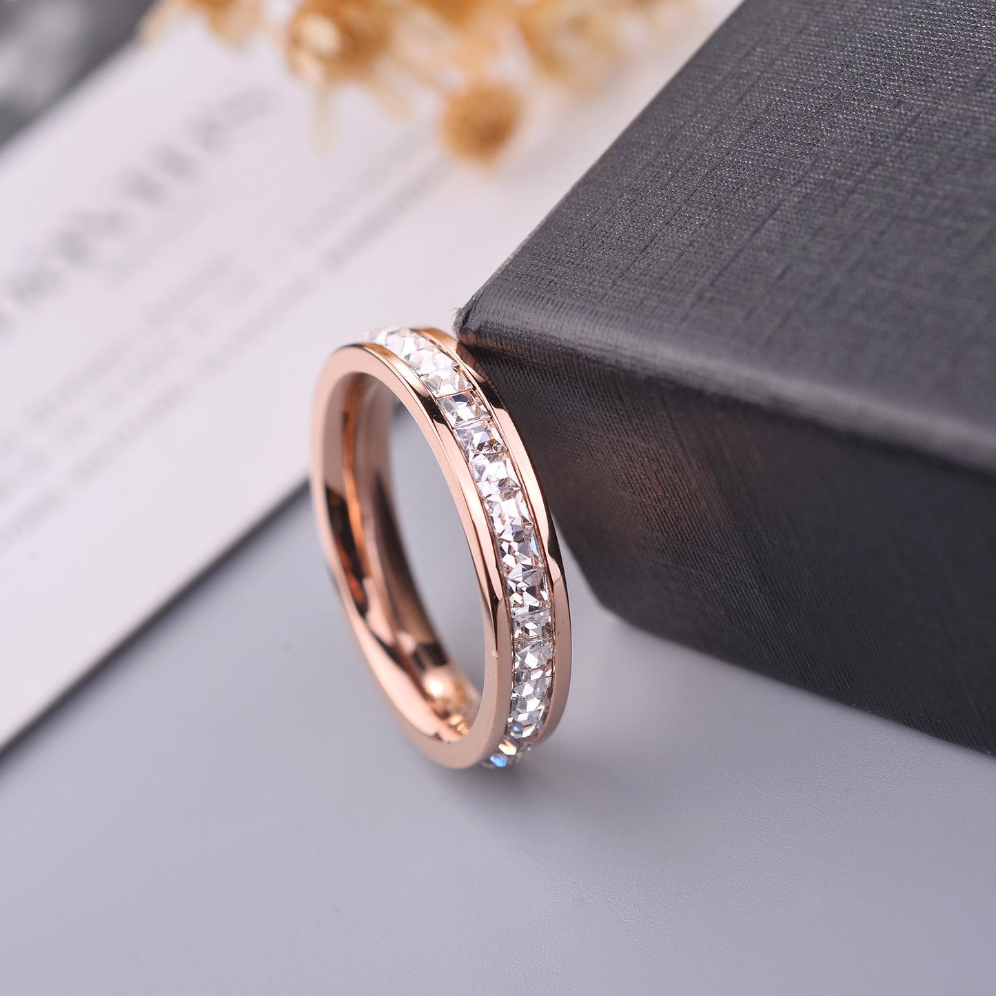 Simple and Elegant Titanium Steel Gold-plated 18K Rose Gold Ring with Sparkling CZ Inlay.