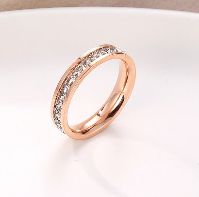 Simple and Elegant Titanium Steel Gold-plated 18K Rose Gold Ring with Sparkling CZ Inlay.