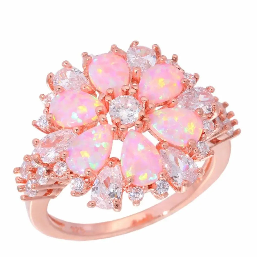 Large Pink Fire Opal Stone Rose Gold Crystal Flower Ring Adorned with Dazzling Gemstones.
