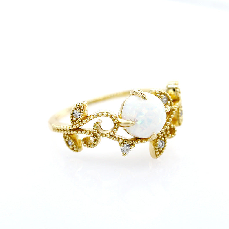 Ornate Faux Opal Sterling Silver Ring Adorned with Sparkling Gemstone Floral Inlays.