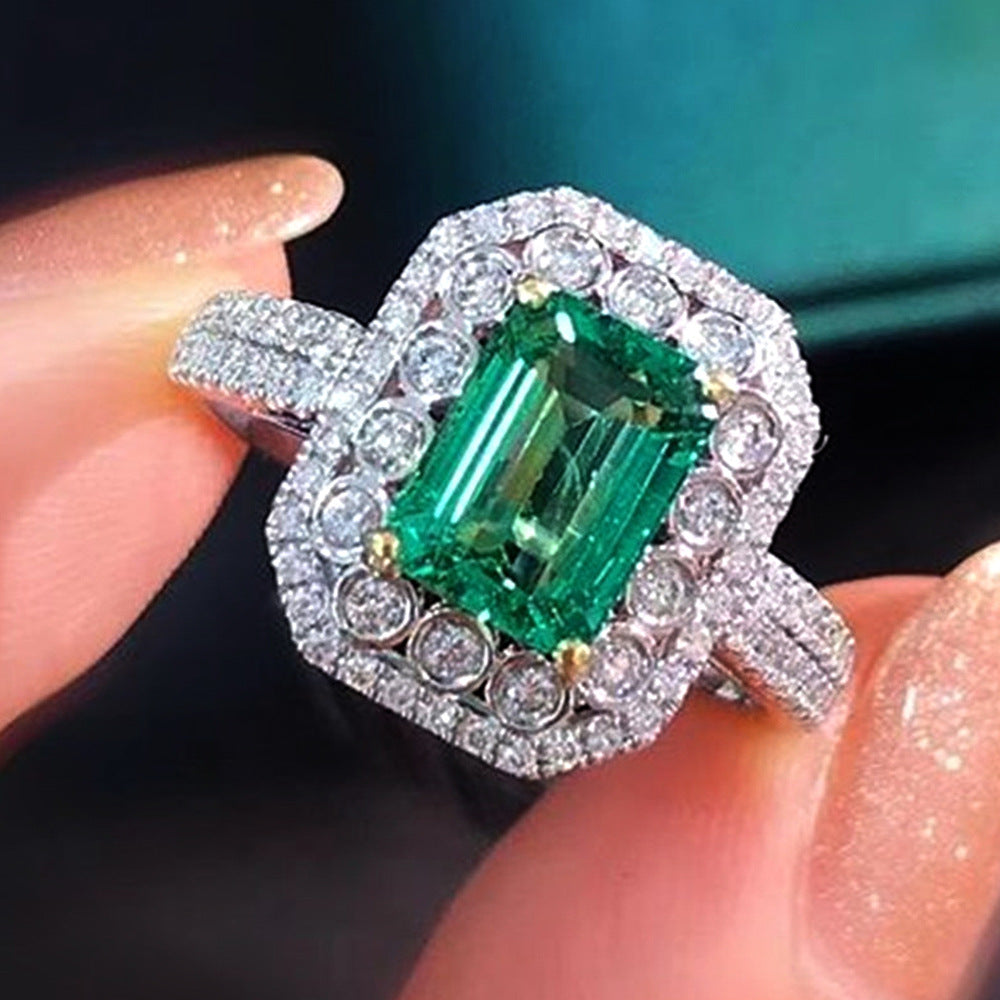 Sparkling Emerald Cocktail Ring Surrounded by Gemstones.